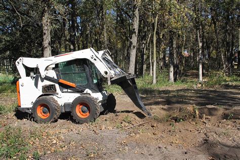 best way to digging with a skid steer bucket 